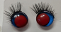 Preview: Sicherheitsaugen blau metallic rote Pupille schielend mit Wimpern trapezoid 14 mm